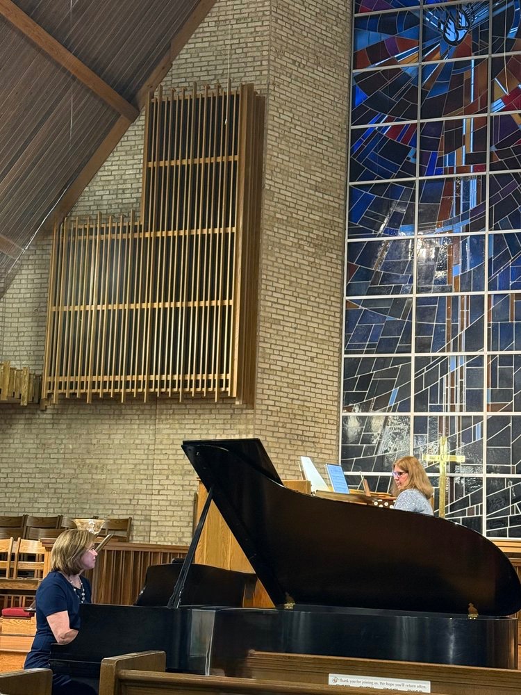 Carmen and Rene performing on piano and organ